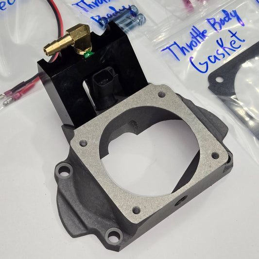 E-Cool upgrade injector housing and cast throttle-body adapter assembled with the mounting gasket
