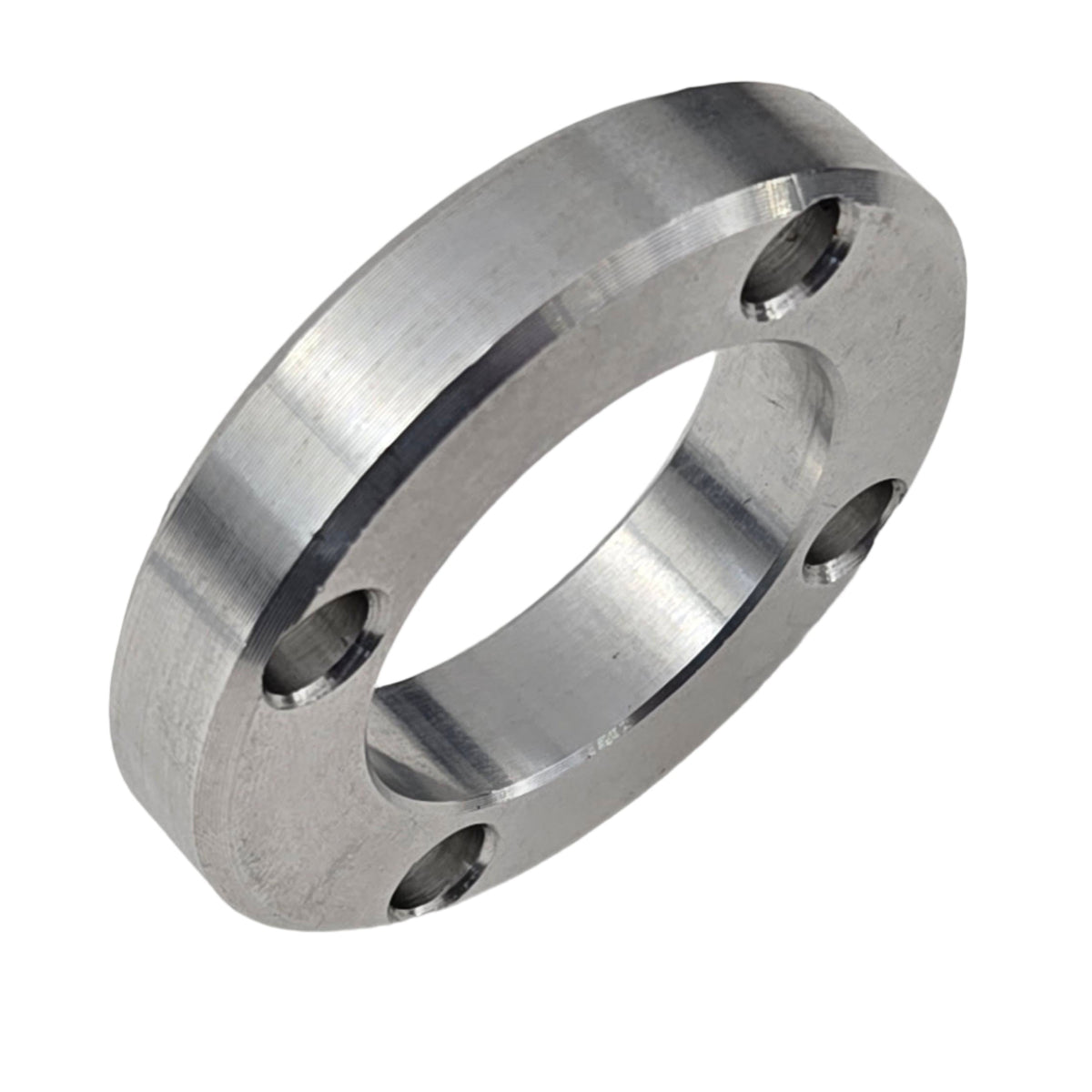 TVS900 1.6-liter Miata pulley spacer in a front three-quarter view showing its thickness and four mounting holes