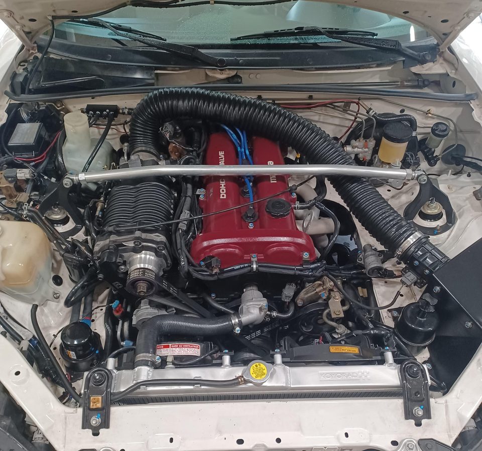 Jason's white 1999 Miata engine bay with an FFS Standard Kit