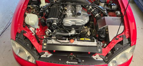 Marty's red 2001 Miata engine bay with an FFS Standard Supercharger Kit