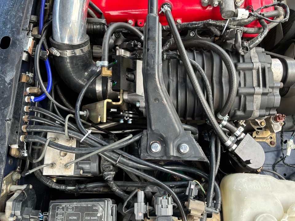 Close-up of the MP62 supercharger in Nathaniel's 2001 Miata