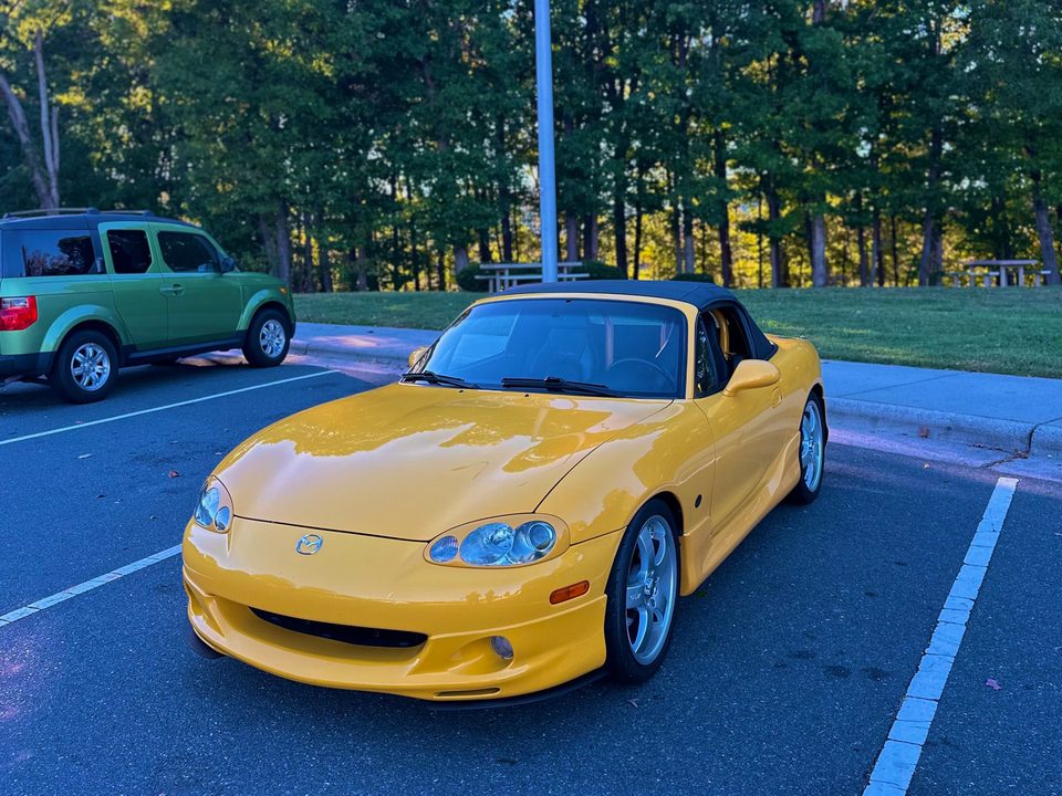 Taylor's yellow 2002 Miata